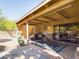 Covered patio with seating area, hot tub, and cactus plants at 14679 N Love Ct, Fountain Hills, AZ 85268