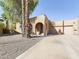 Charming single-story home with a gravel driveway and mature palm trees at 14679 N Love Ct, Fountain Hills, AZ 85268