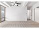 Spacious bedroom featuring a ceiling fan and access to a hallway at 7117 E Rancho Vista Dr # 2005, Scottsdale, AZ 85251