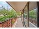 Spacious balcony with glass walls and treetop views at 7117 E Rancho Vista Dr # 2005, Scottsdale, AZ 85251