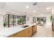 Modern kitchen features a large island, stainless steel appliances, and white quartz countertops at 7117 E Rancho Vista Dr # 2005, Scottsdale, AZ 85251
