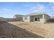 Large backyard with dirt and a block wall at 1471 S 239Th Dr, Buckeye, AZ 85326