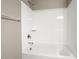 Bathroom with shower/tub combo and built in shelving at 1471 S 239Th Dr, Buckeye, AZ 85326