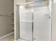 Clean bathroom featuring a shower stall and shelving at 1471 S 239Th Dr, Buckeye, AZ 85326