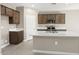 Modern kitchen with island and ample cabinet storage at 1471 S 239Th Dr, Buckeye, AZ 85326