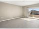 Bright living room with sliding glass doors leading to backyard at 1471 S 239Th Dr, Buckeye, AZ 85326