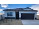 New single-story home with a two-car garage and desert landscaping at 1471 S 239Th Dr, Buckeye, AZ 85326
