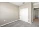 Bedroom with plush carpet, and double door closet at 1471 S 239Th Dr, Buckeye, AZ 85326