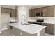 Spacious kitchen with stainless steel appliances and large island at 1471 S 239Th Dr, Buckeye, AZ 85326