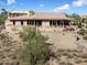 Desert landscape showcasing a large one-story home with a large patio at 11420 N Kiowa Cir, Fountain Hills, AZ 85268