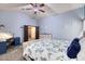 Main bedroom with king-size bed, ceiling fan, and an attached sitting area at 775 E Leslie Ave, San Tan Valley, AZ 85140