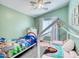 Bedroom with twin beds, ceiling fan, and ample natural light at 775 E Leslie Ave, San Tan Valley, AZ 85140