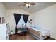 Small bedroom with a twin bed, desk, and built-in shelving at 775 E Leslie Ave, San Tan Valley, AZ 85140