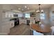 Modern kitchen with white cabinets, stainless steel appliances, and breakfast nook at 812 W Brooks St, Chandler, AZ 85225