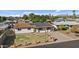 Property view showing a house with a yard and solar panels at 7428 E Carol Cir, Mesa, AZ 85208