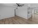Bright living room with hardwood floors and ceiling fan at 7428 E Carol Cir, Mesa, AZ 85208