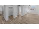 Bright bedroom with wood-look floors and ample space at 7428 E Carol Cir, Mesa, AZ 85208