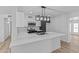 Modern kitchen with white quartz countertops and stainless steel appliances at 7428 E Carol Cir, Mesa, AZ 85208