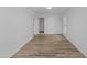 Simple bedroom with hardwood floors and neutral walls at 7428 E Carol Cir, Mesa, AZ 85208