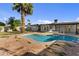 Inviting kidney-shaped pool with flagstone patio and spacious backyard at 7428 E Carol Cir, Mesa, AZ 85208