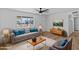 Living room with grey couch and mid century modern decor at 7428 E Carol Cir, Mesa, AZ 85208
