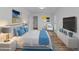 Spacious bedroom with light walls and hardwood floors at 7428 E Carol Cir, Mesa, AZ 85208