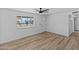 Spacious living room with hardwood floors and large window at 7428 E Carol Cir, Mesa, AZ 85208