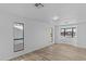 Bright living room with hardwood floors and large windows at 7428 E Carol Cir, Mesa, AZ 85208