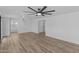 Bright and airy living room with hardwood floors and ceiling fan at 7428 E Carol Cir, Mesa, AZ 85208
