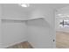 Well-lit closet with shelving, ready for storage at 7428 E Carol Cir, Mesa, AZ 85208