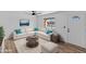 Bright living room featuring a sectional sofa and a coffee table at 7428 E Carol Cir, Mesa, AZ 85208