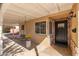 Covered porch with hanging bench and potted plants at 5745 N 13Th St, Phoenix, AZ 85014