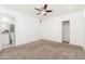 Cozy carpeted bedroom with a private bathroom and a double-door closet at 5745 N 13Th St, Phoenix, AZ 85014