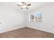 Spacious bedroom with neutral carpeting, ceiling fan and large window with shutters at 5745 N 13Th St, Phoenix, AZ 85014