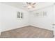 Well-lit bedroom with carpet flooring, ceiling fan and window shutters at 5745 N 13Th St, Phoenix, AZ 85014