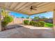 Covered patio with ceiling fan, string lights and grassy backyard at 5745 N 13Th St, Phoenix, AZ 85014