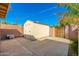Tan shed in backyard with gated access at 5745 N 13Th St, Phoenix, AZ 85014