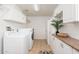 Bright laundry room with washer, dryer and ample cabinetry at 5745 N 13Th St, Phoenix, AZ 85014