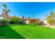 Spacious backyard with grassy area and view of home at 5745 N 13Th St, Phoenix, AZ 85014