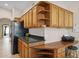Kitchen with wood cabinets, granite countertops and desk at 15758 W Edgemont Ave, Goodyear, AZ 85395