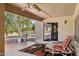 Relaxing covered patio with comfortable seating area at 15758 W Edgemont Ave, Goodyear, AZ 85395