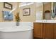 Bathroom features a large soaking tub and double vanity at 15758 W Edgemont Ave, Goodyear, AZ 85395