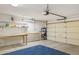 Garage with workbench, storage, and flooring at 15758 W Edgemont Ave, Goodyear, AZ 85395