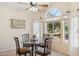 Breakfast nook with glass table and four chairs at 15758 W Edgemont Ave, Goodyear, AZ 85395