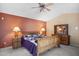 Main bedroom with wood furniture and ceiling fan at 15758 W Edgemont Ave, Goodyear, AZ 85395