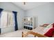 Bedroom with window, shelving unit, and bed at 15758 W Edgemont Ave, Goodyear, AZ 85395