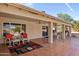 Extended covered patio with seating and tile flooring at 15758 W Edgemont Ave, Goodyear, AZ 85395
