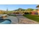 Landscaped backyard oasis with a pool, spa, and mountain views at 2554 N Tambor --, Mesa, AZ 85207