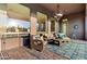 Covered patio with wicker furniture and chandelier, ideal for relaxing at 2554 N Tambor --, Mesa, AZ 85207