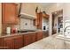 Kitchen details, including gas cooktop and granite countertops at 2554 N Tambor --, Mesa, AZ 85207